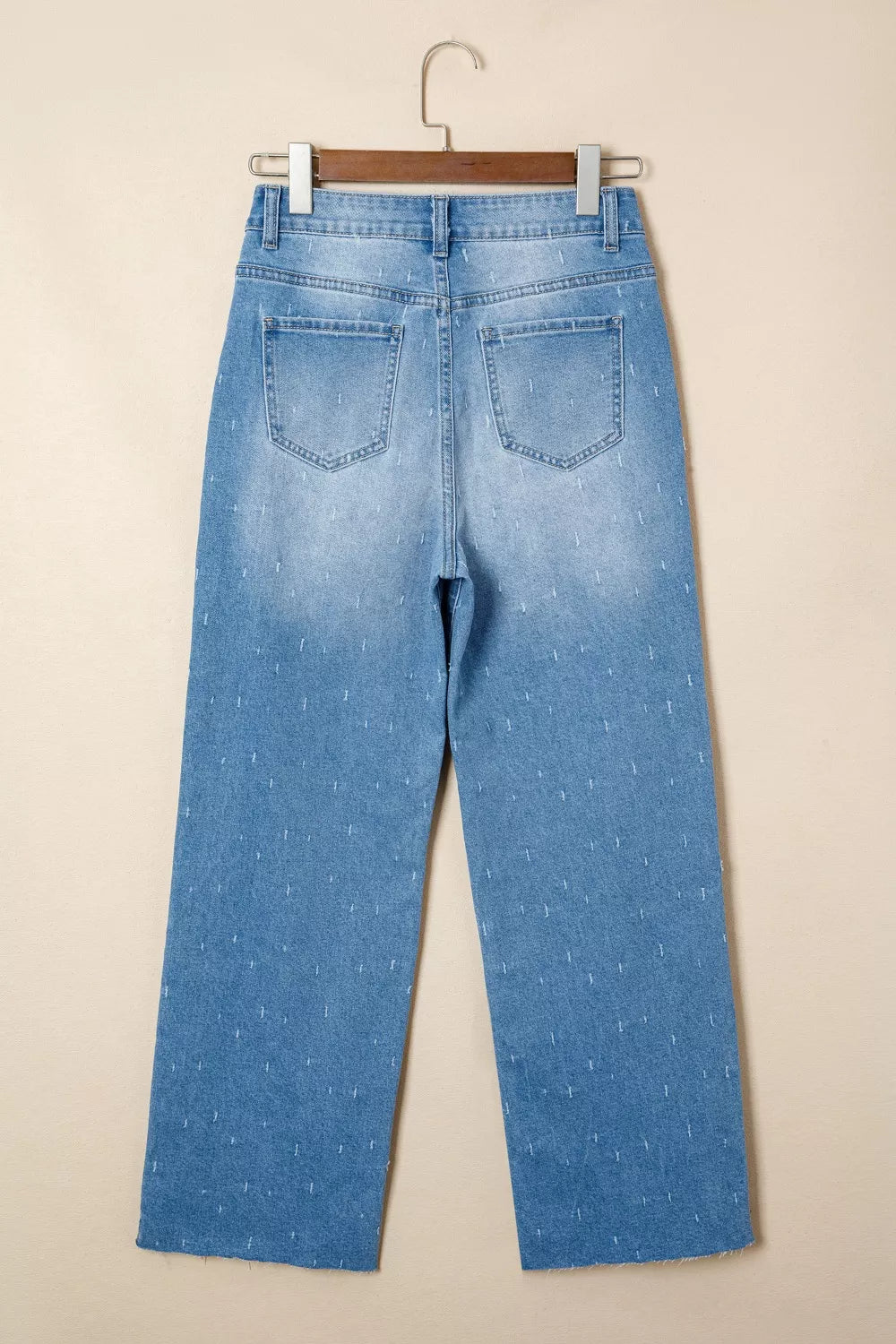 Distressed wide-leg jeans with tummy control and raw hem