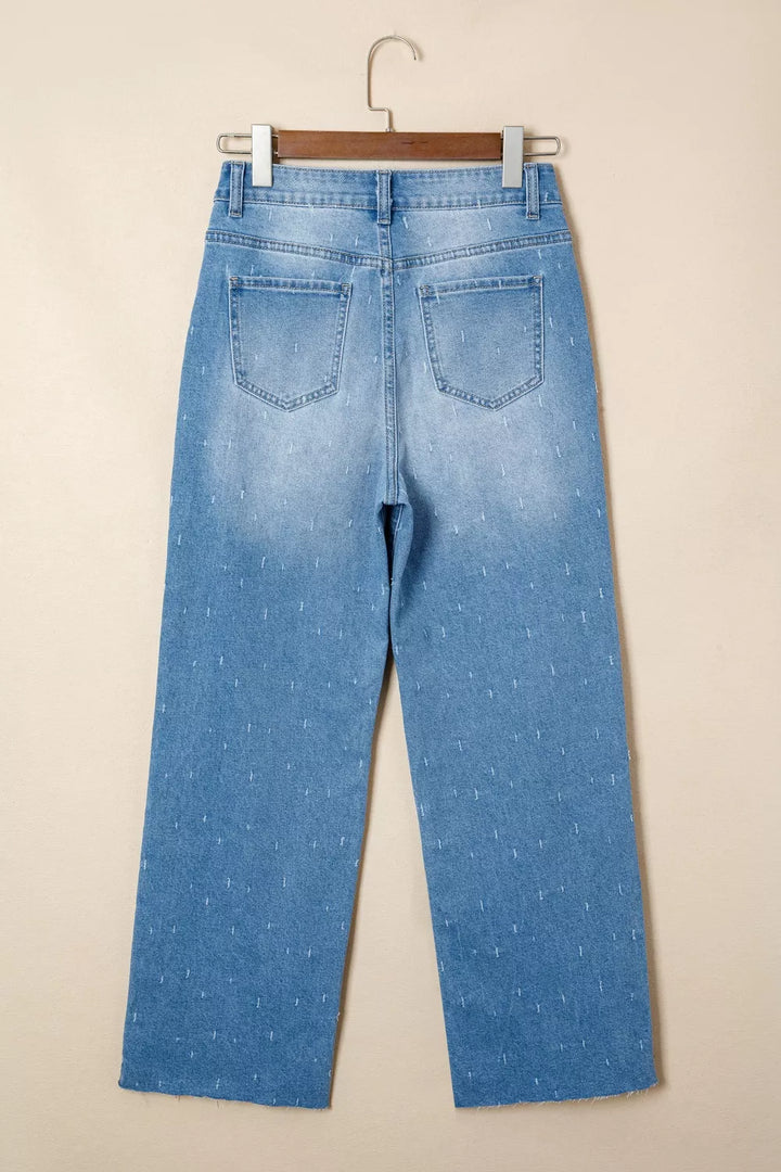 Distressed wide-leg jeans with tummy control and raw hem
