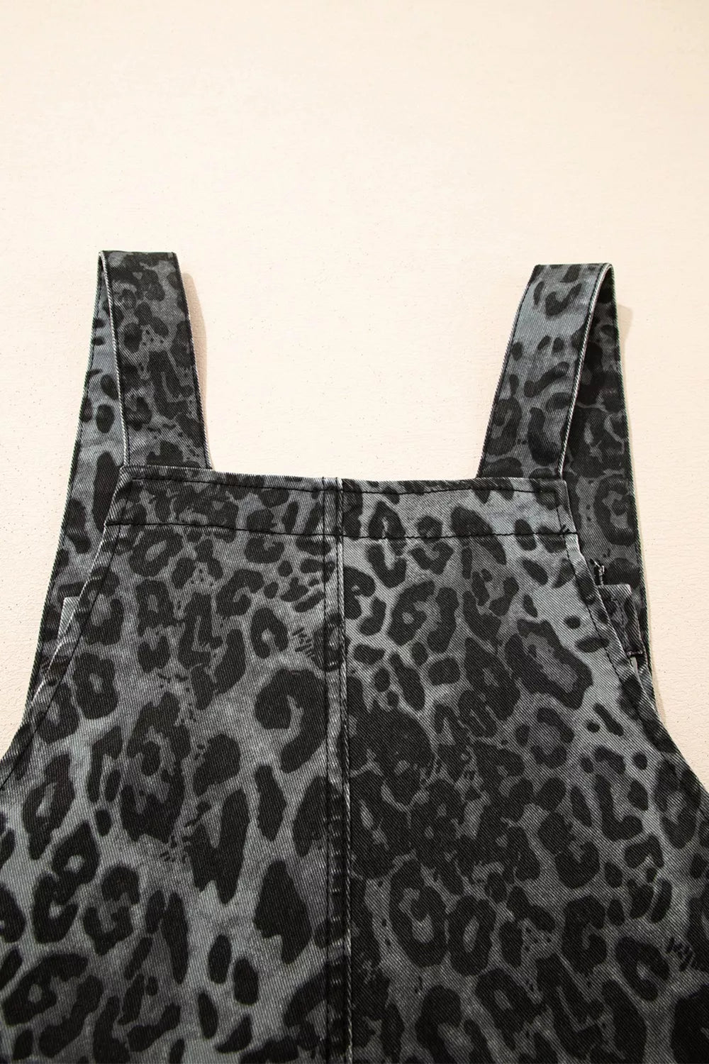 Leopard print cropped wide-leg denim overalls with raw hem