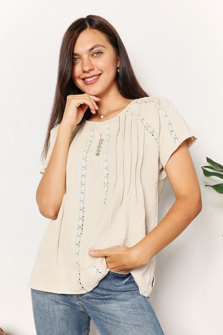 Crochet trim pintuck short sleeve top with button placket