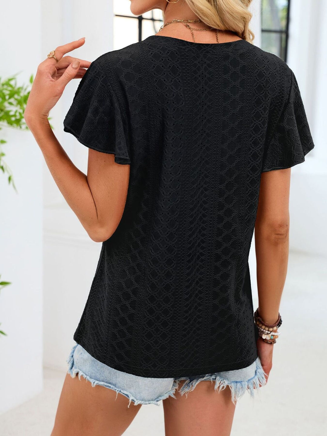 Eyelet flutter sleeve V-neck top with ruched neckline