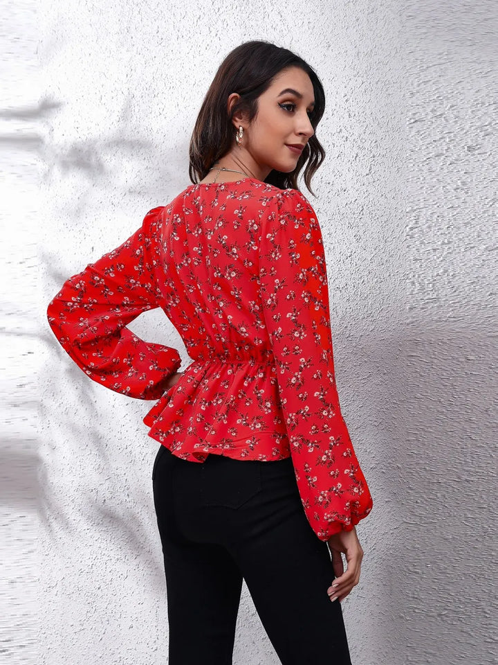 Floral peplum blouse with V-neck and balloon sleeves