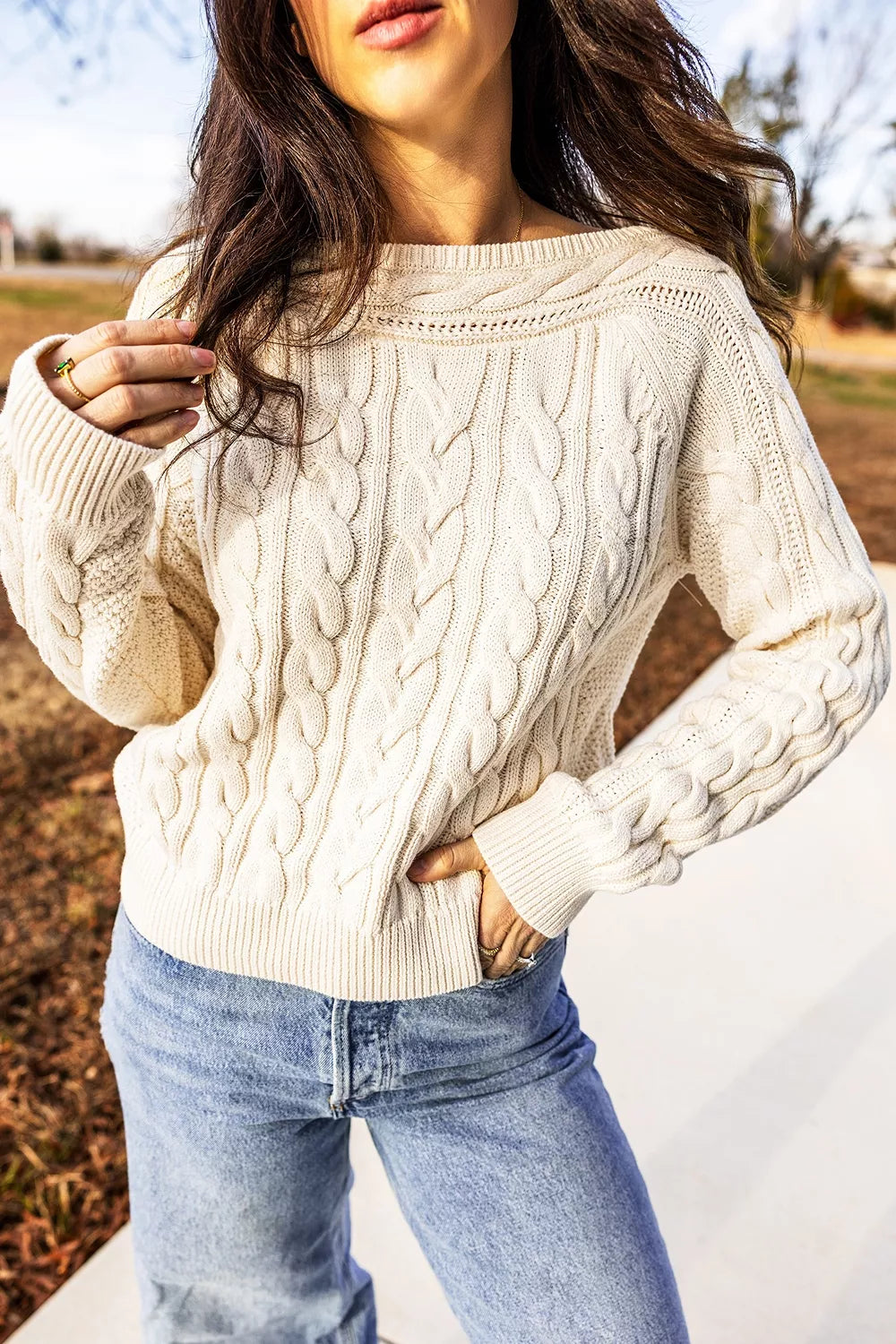 Cable knit drop shoulder sweater with ribbed cuffs