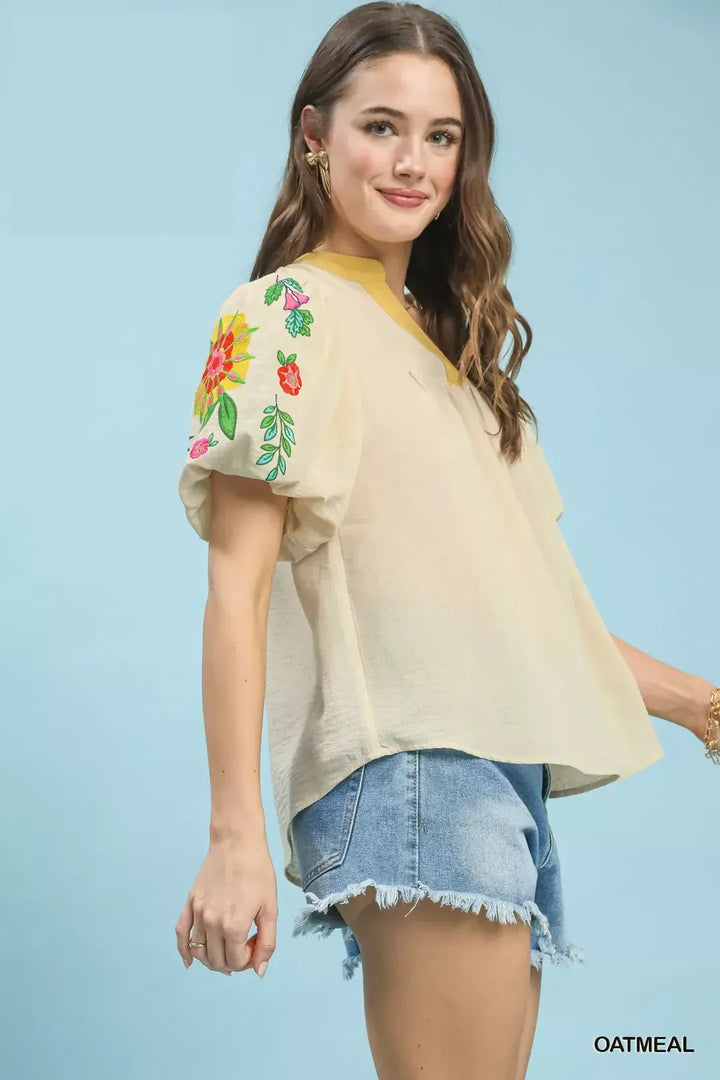Floral embroidered puff sleeve top with split V-neck
