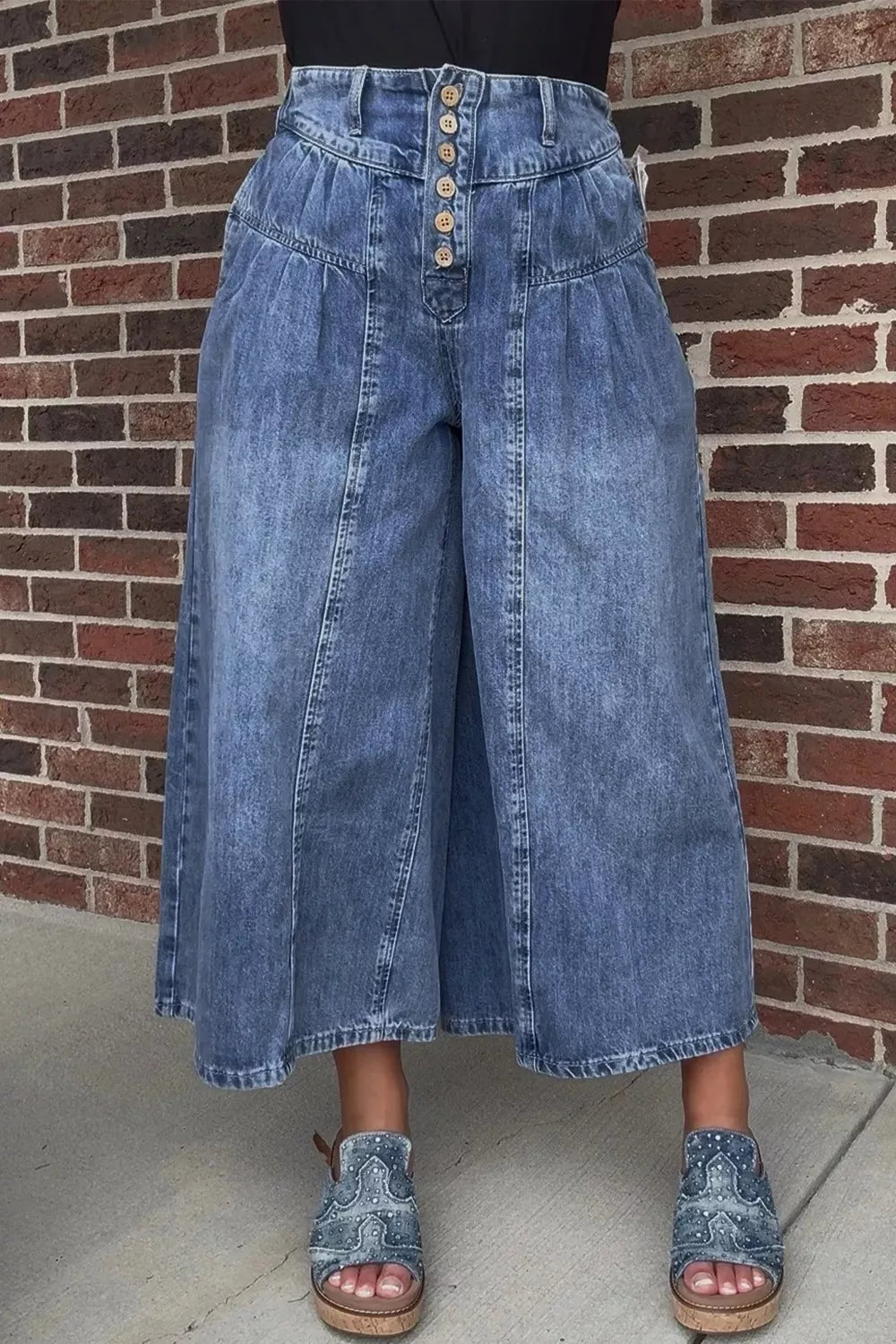 High-rise wide-leg button-fly jeans with pleated waist