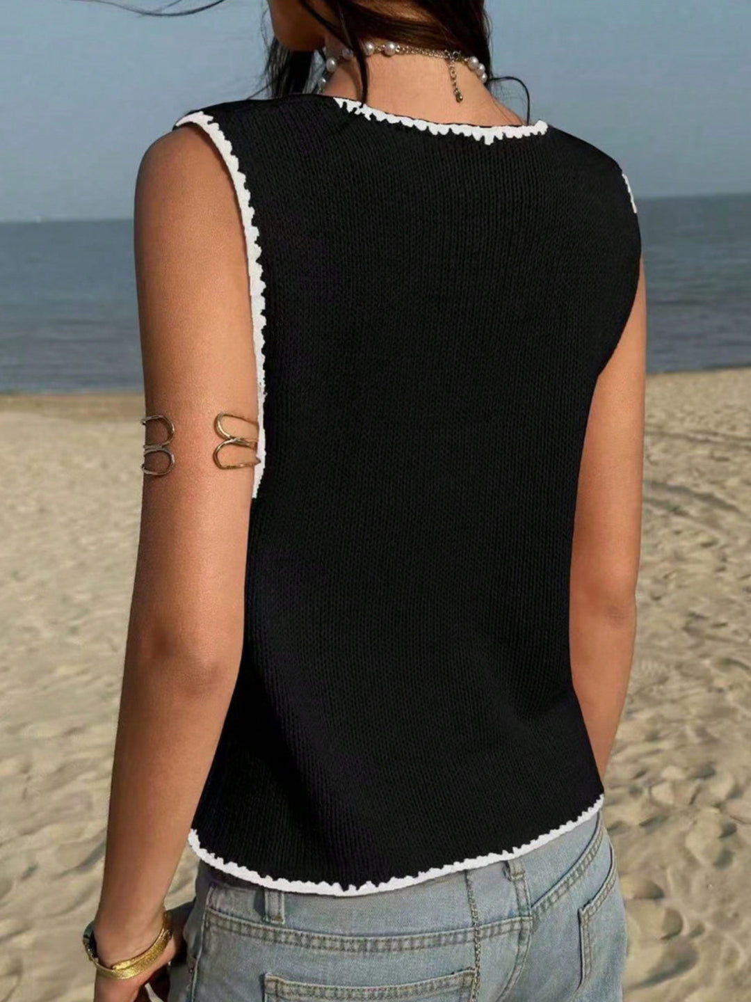 Button-front knit sweater vest with contrast whipstitch trim