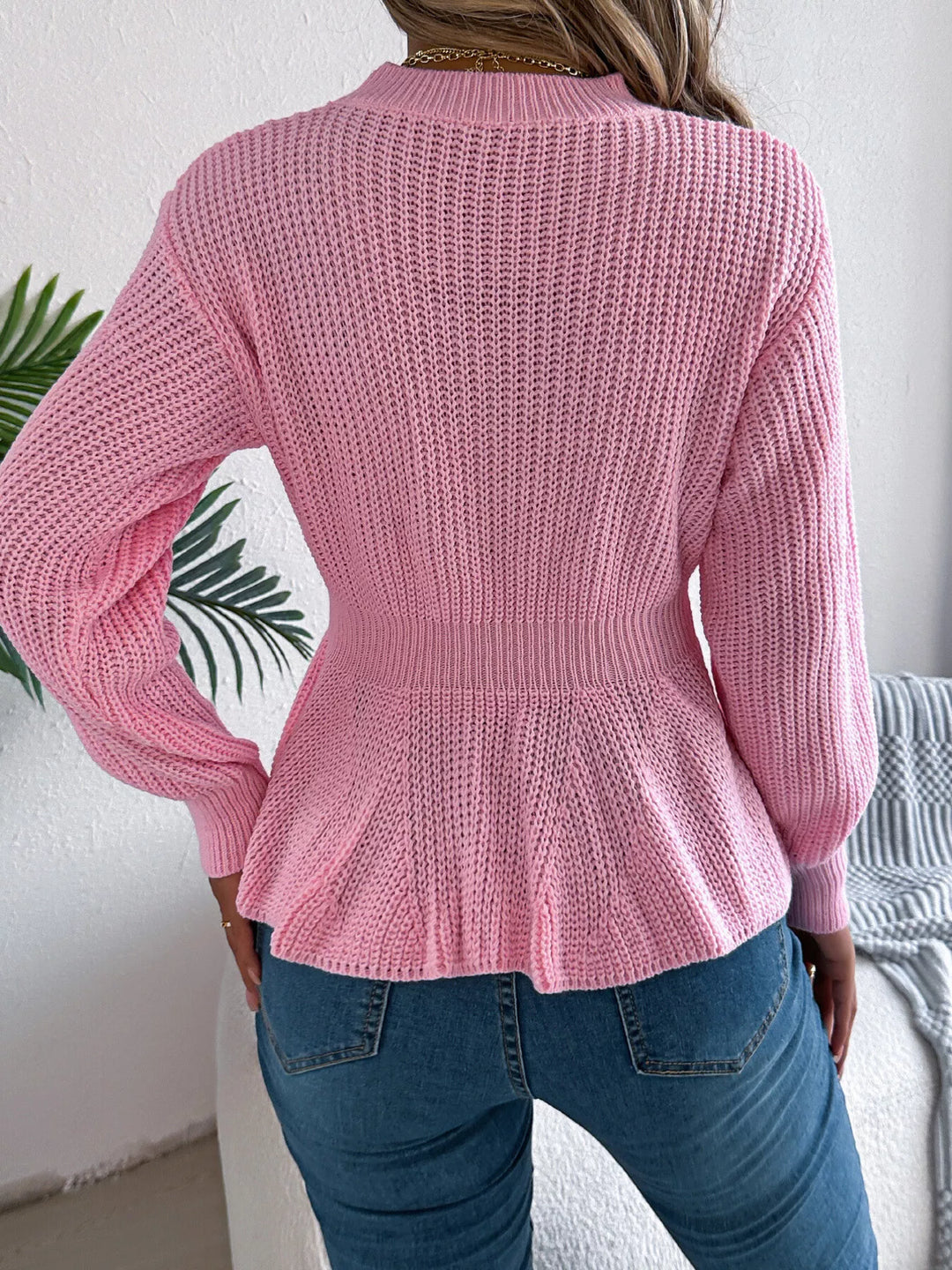 Cable knit peplum sweater with mock neck