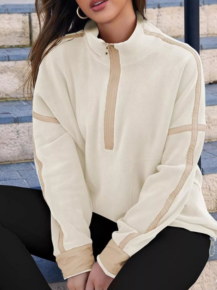Half-zip fleece pullover with contrast trim and zip pockets