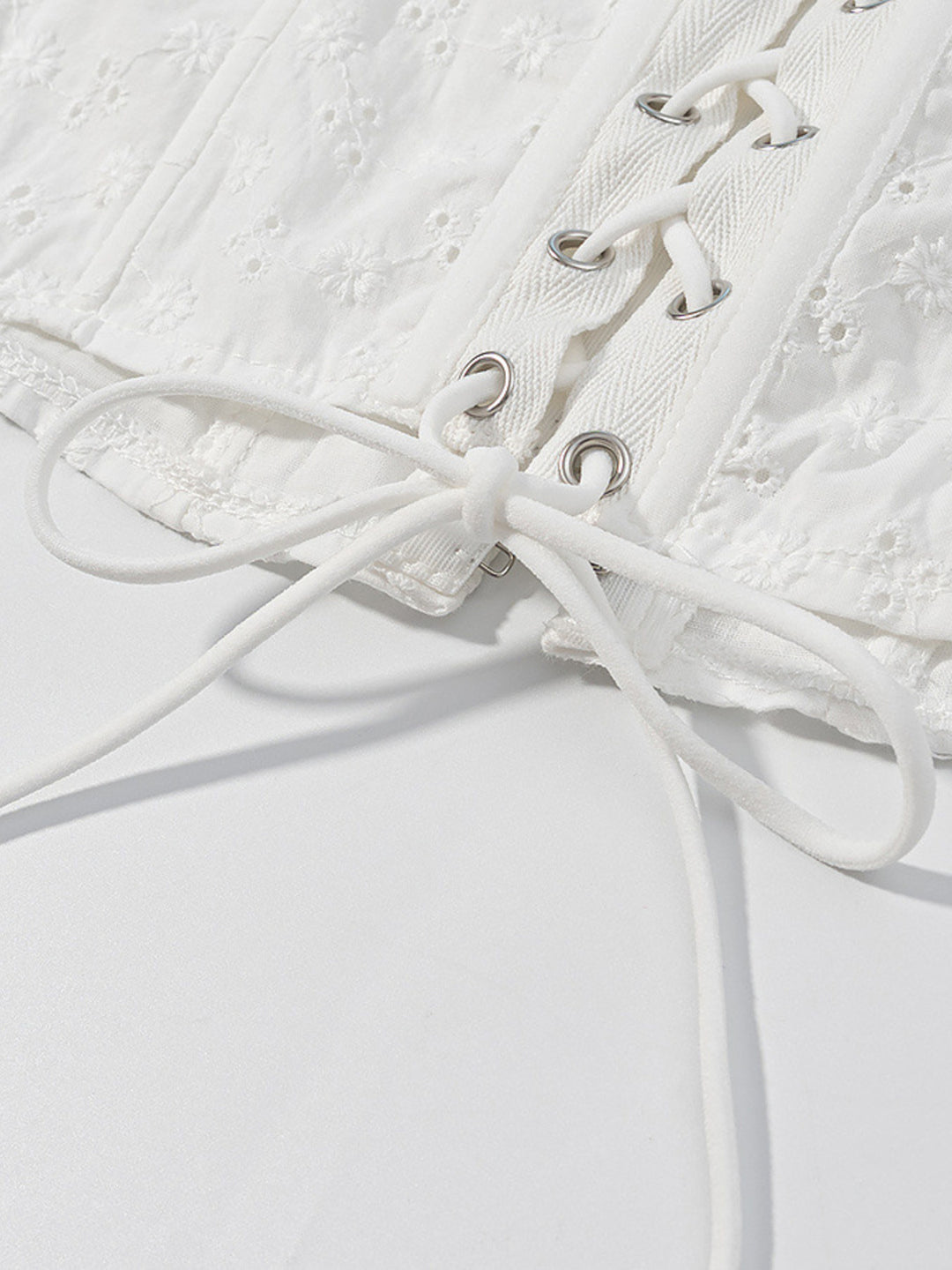 Eyelet ruffle-trim corset tank top with lace-up back