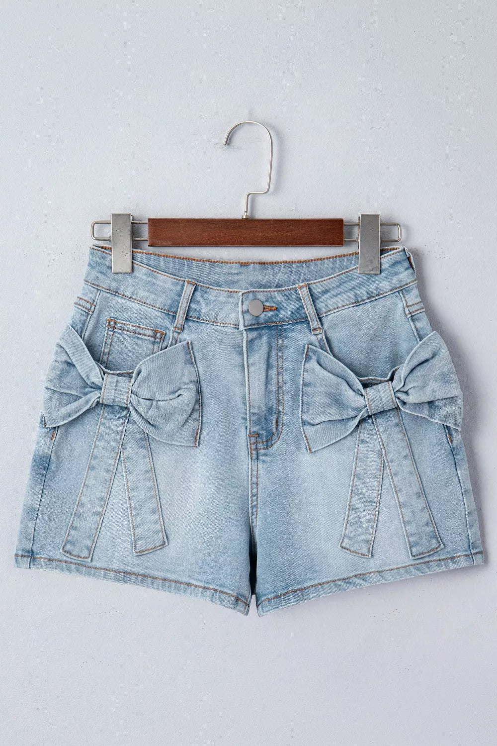 Mid-rise denim shorts with bow-tied front patch pockets