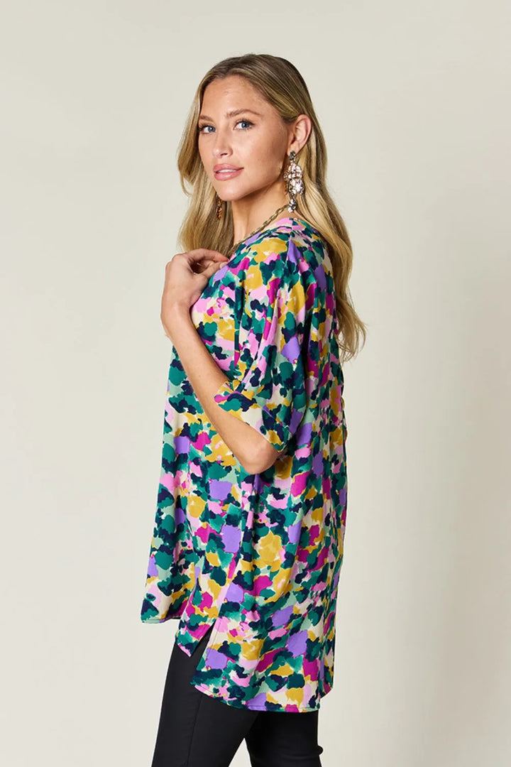 Abstract print v-neck tunic top with flutter sleeves and side slits