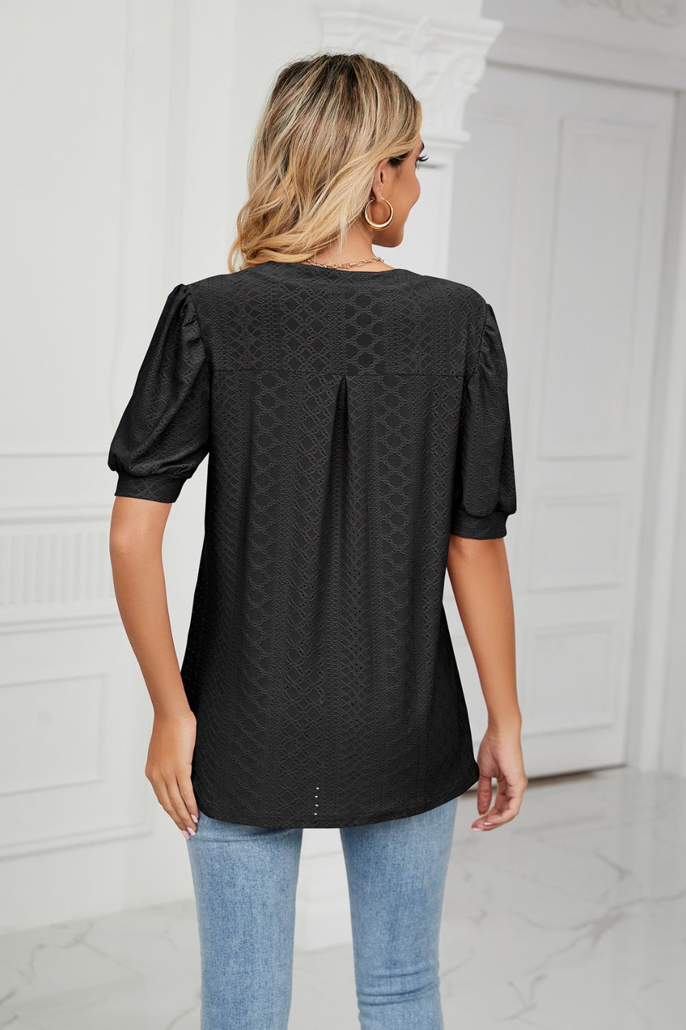 Eyelet puff sleeve top with notched V-neck