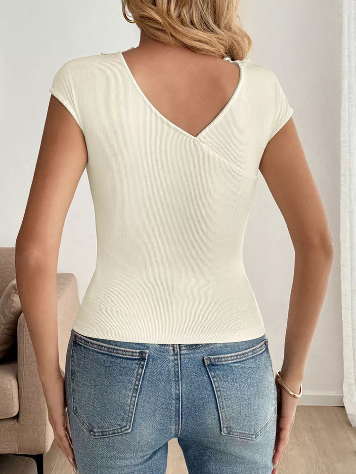 Ribbed knit cap sleeve V-neck top with bow trim