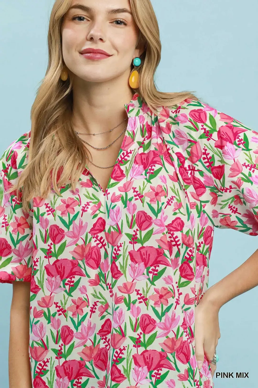 Floral split-neck puff sleeve blouse with scalloped hem