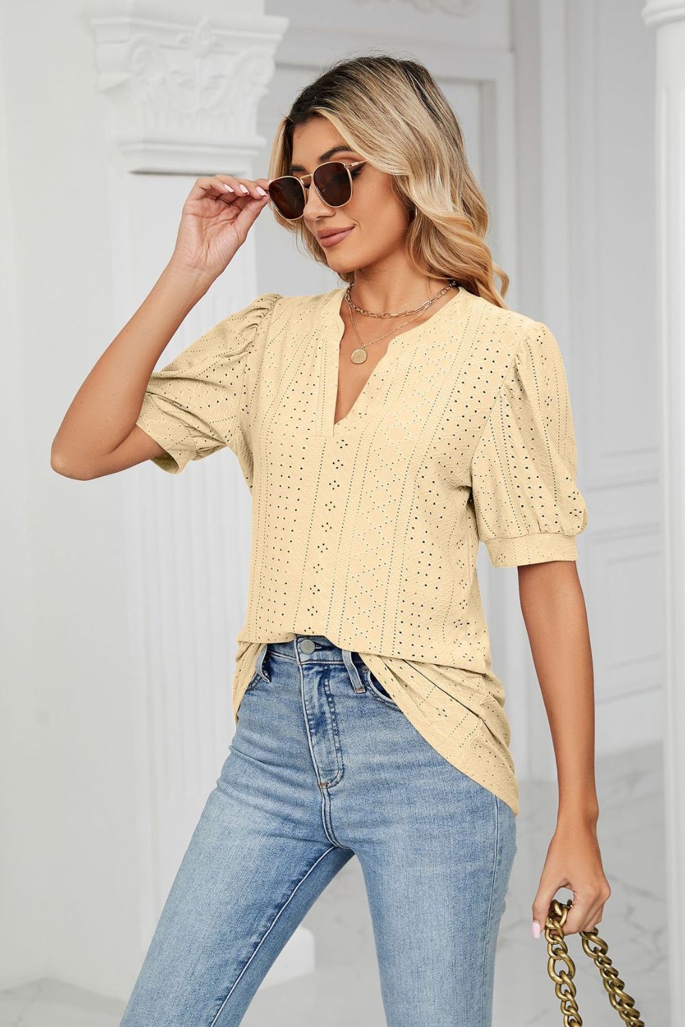 Eyelet puff sleeve top with notched V-neck
