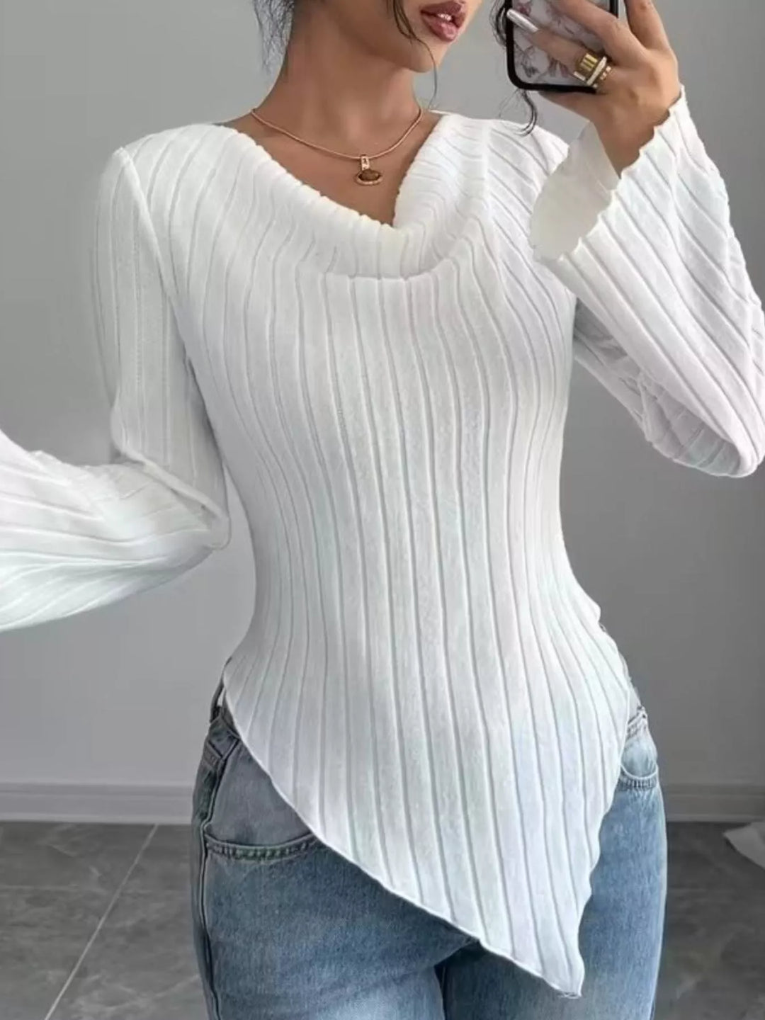 Ribbed knit top with asymmetric hem and flared sleeves