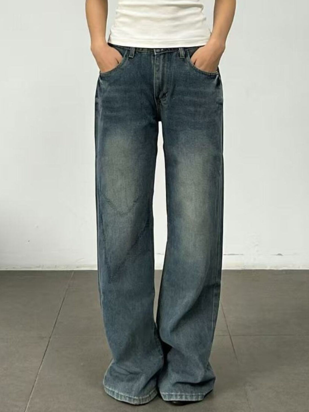 Vintage wash wide leg jeans with whiskered fading