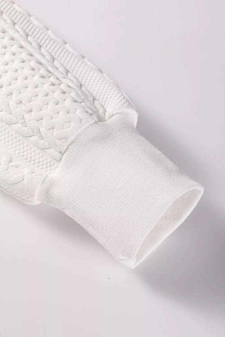 Cable-knit drop-shoulder V-neck pullover sweater