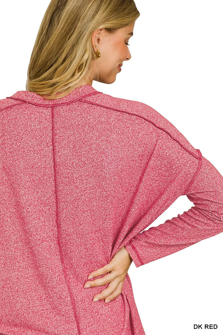 Exposed seam hi-low melange knit long sleeve top