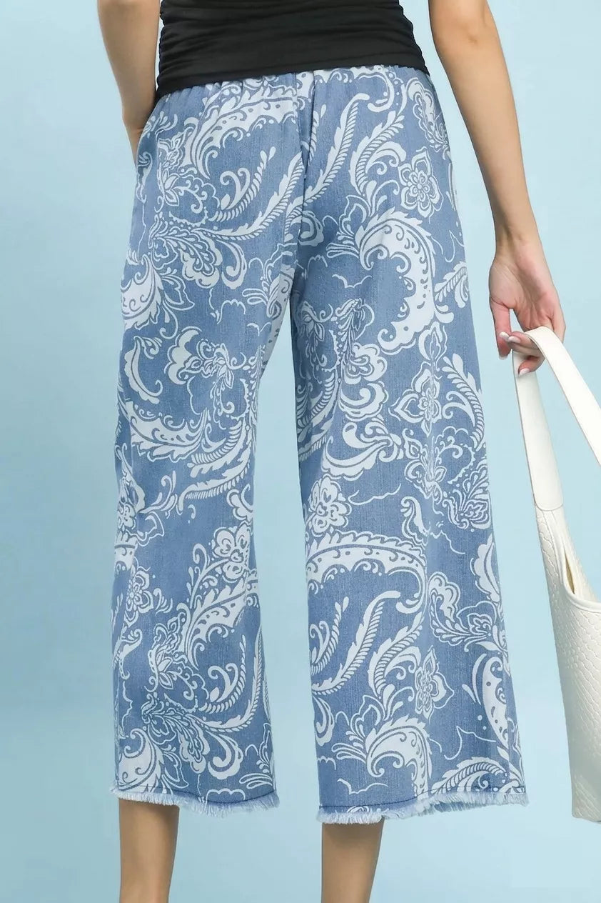 Stone wash floral wide leg crop pants with frayed hem