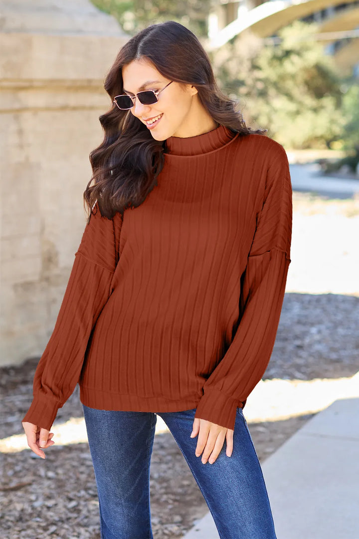 Ribbed exposed-seam mock neck knit top with drop shoulders