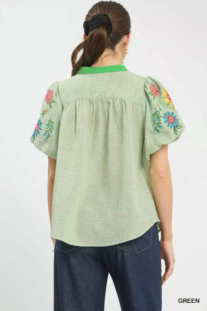 Floral embroidered puff sleeve top with split V-neck