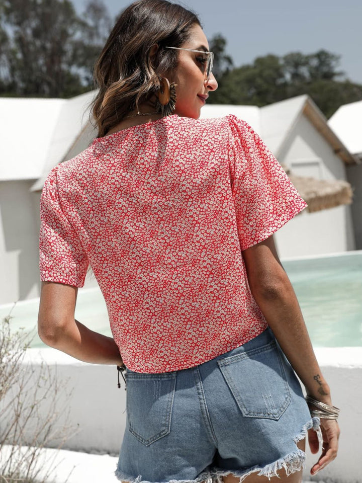 Floral drawstring crop top with deep V-neck and flutter sleeves