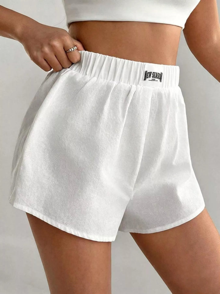 Elastic waist cotton boxer shorts with curved hem