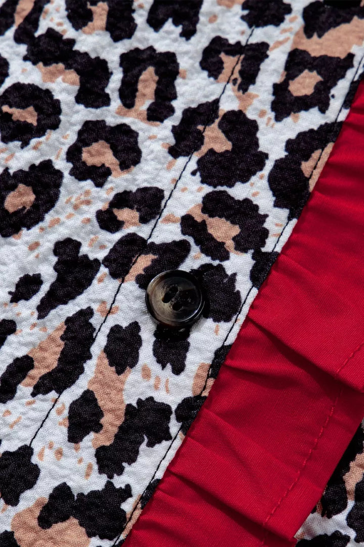 Leopard print short sleeve button-down with contrast ruffle trim