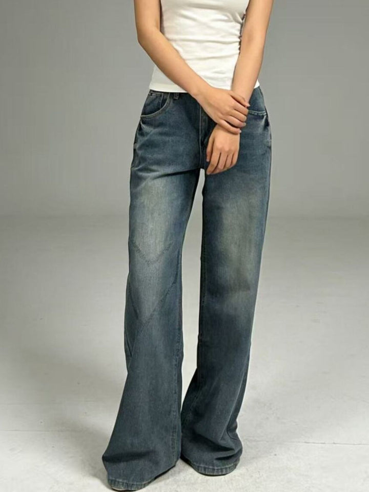 Dark Vintage wash wide leg jeans with whiskered fading