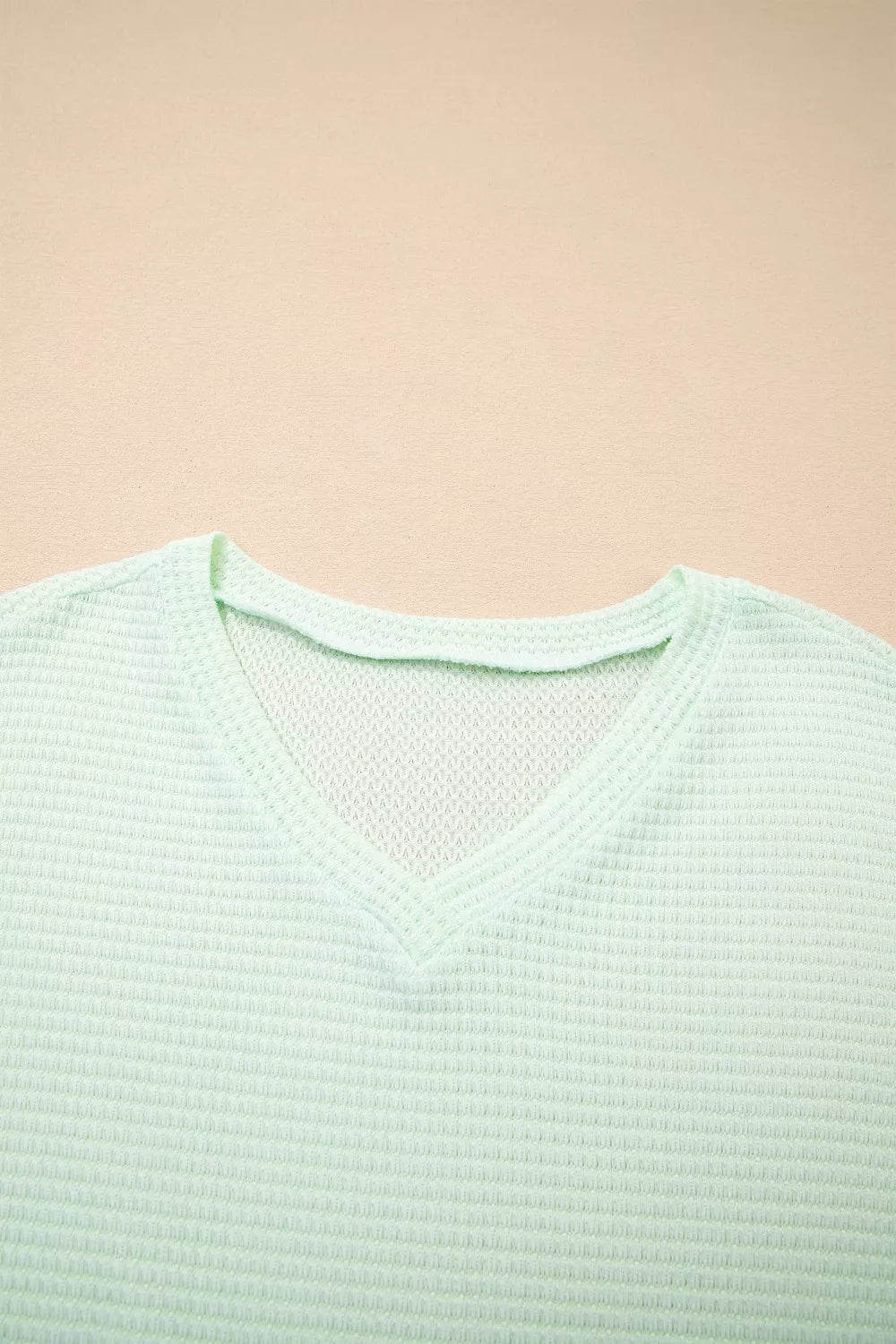 Plus size waffle knit V-neck top with cuffed short sleeves