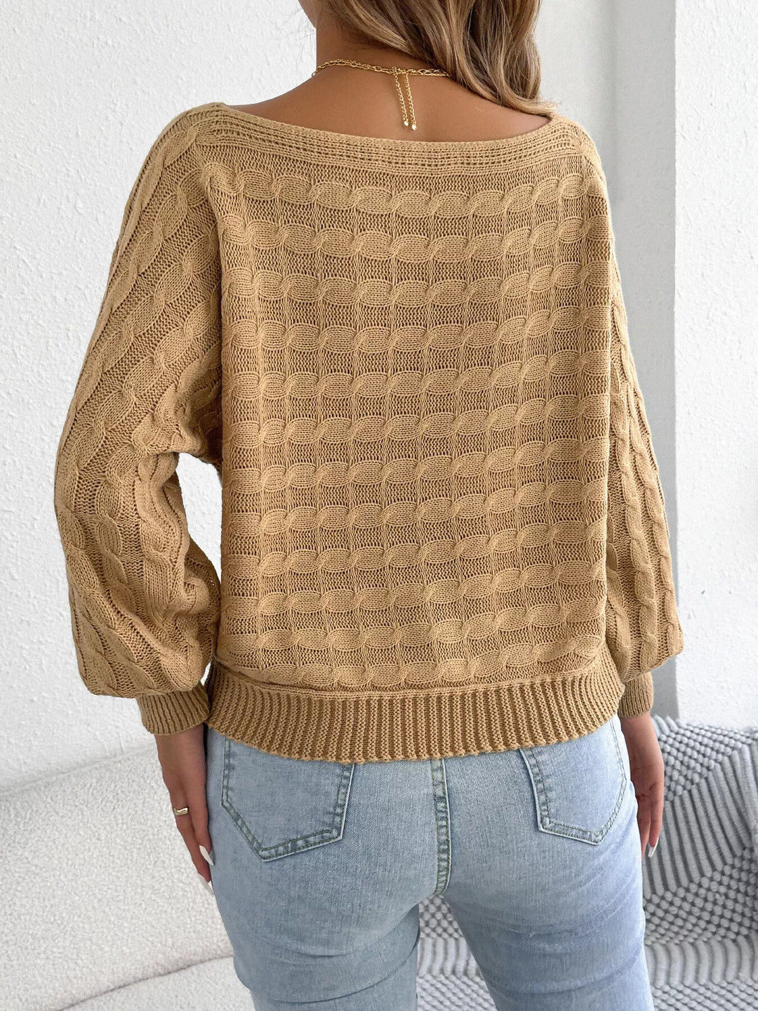 Cable knit boat neck sweater with dolman sleeves