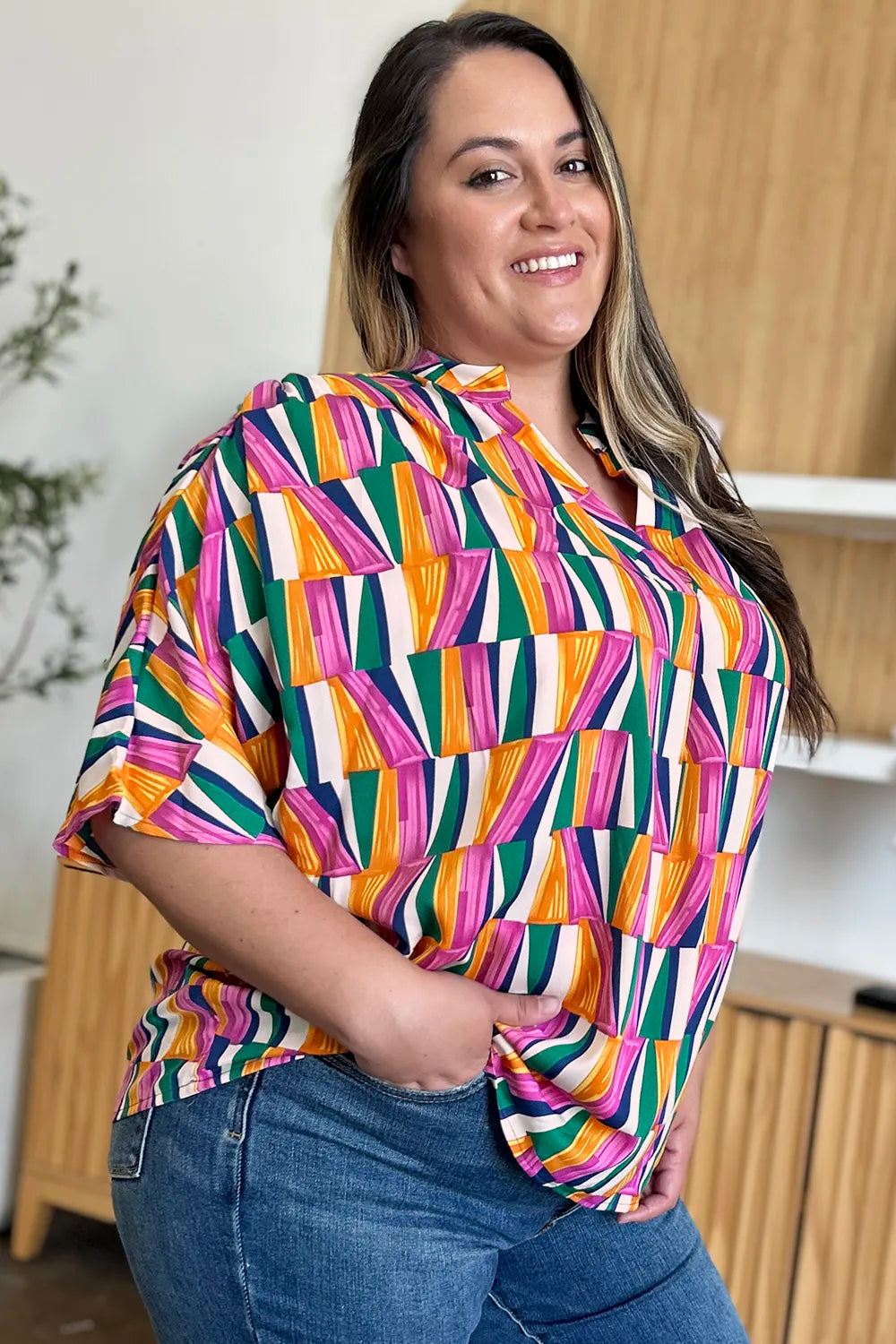 Geometric print notched neck dolman sleeve top
