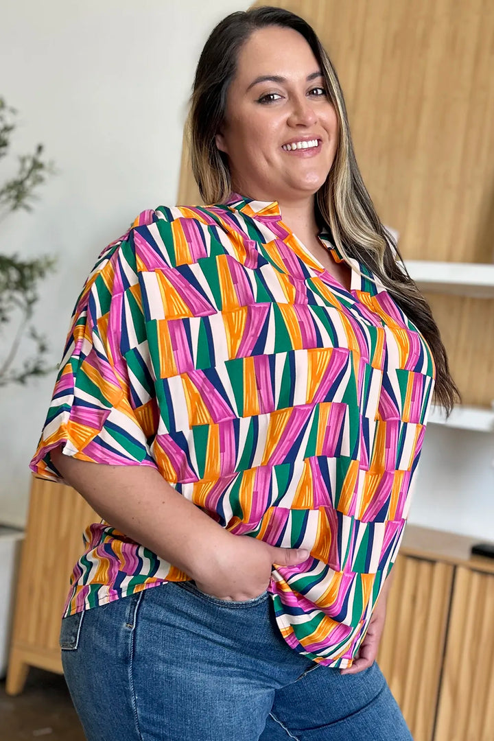 Geometric print notched neck dolman sleeve top