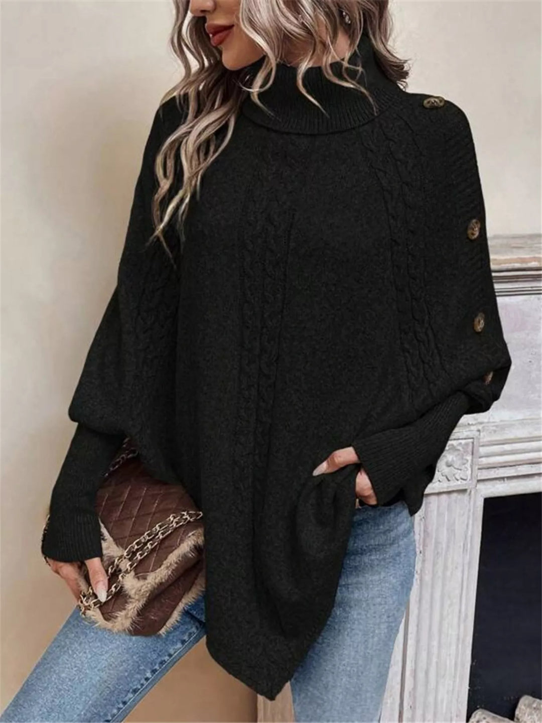 Cable knit turtleneck cape sweater with button shoulder