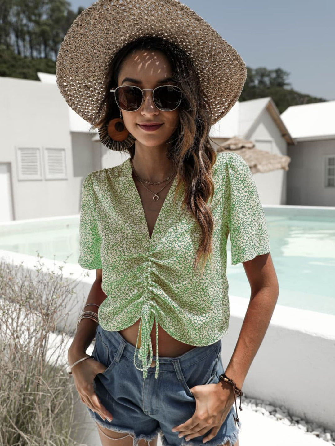 Floral drawstring crop top with deep V-neck and flutter sleeves