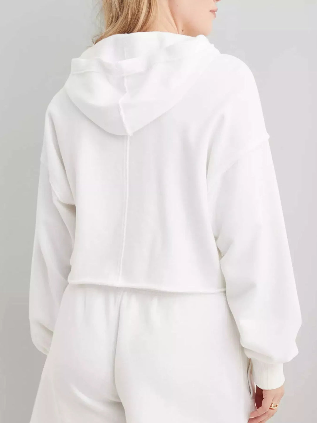 Cropped exposed-seam pullover hoodie with split neck