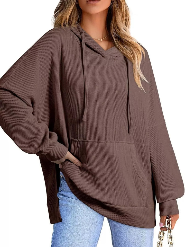 Oversized waffle-knit hoodie with side slits and front pocket