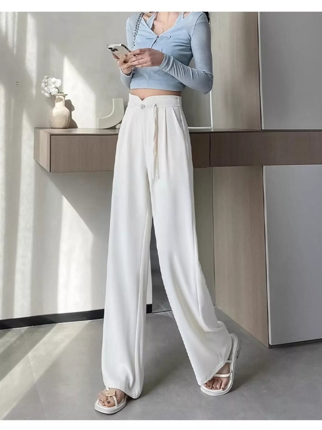 High-rise wide-leg pants with pleated front and tie waist