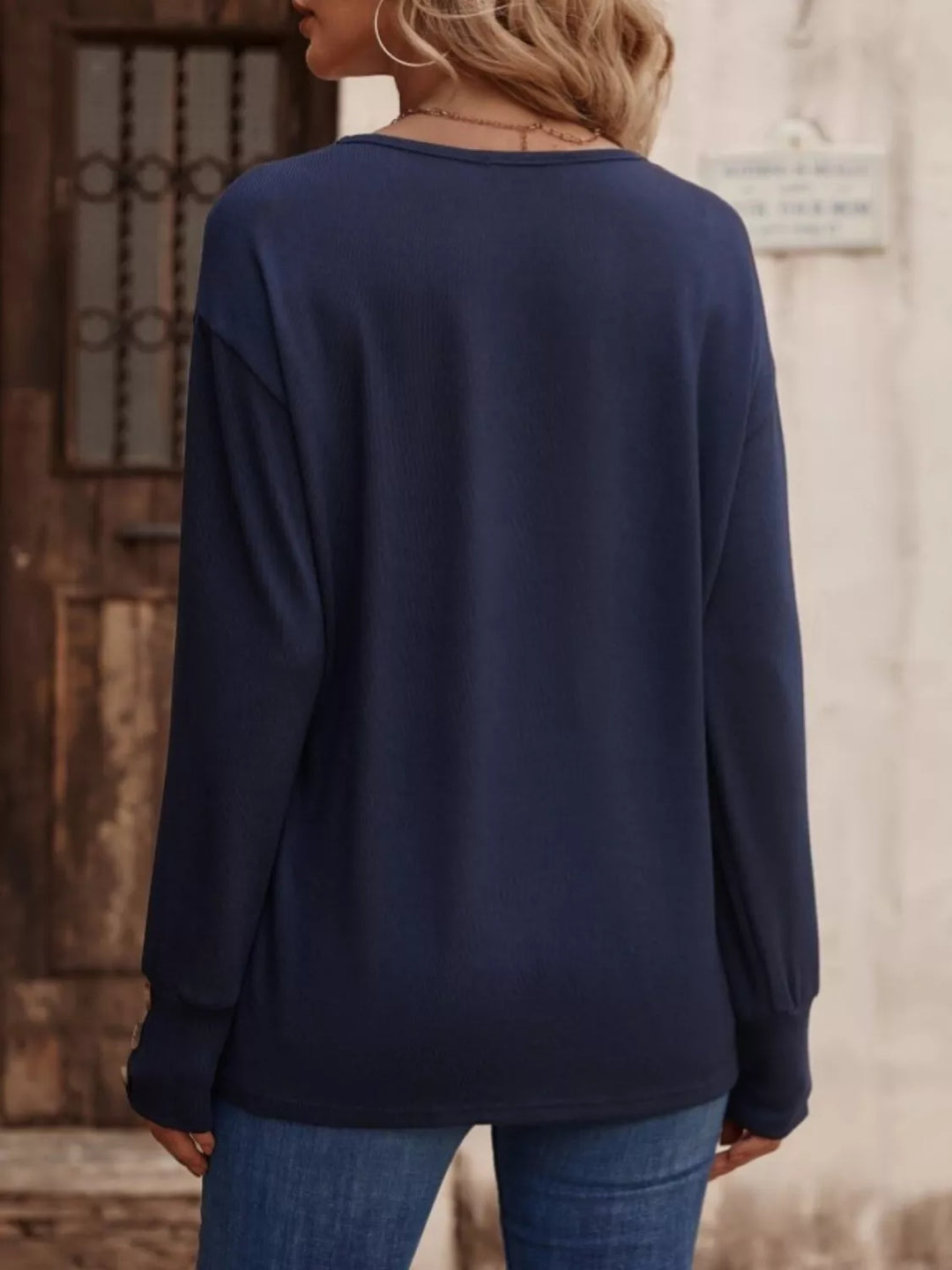 V-neck long sleeve top with button cuffs