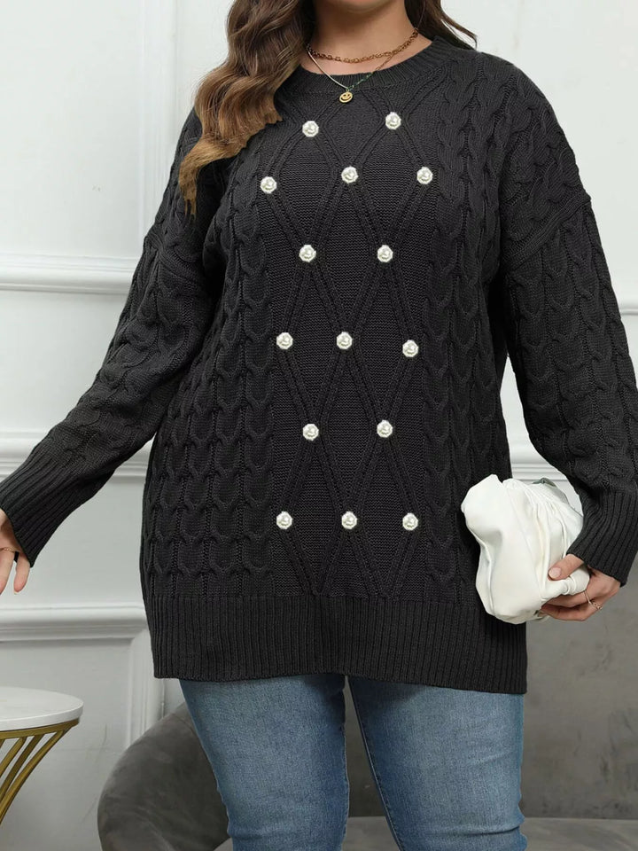 Cable knit dropped shoulder sweater with floral buttons