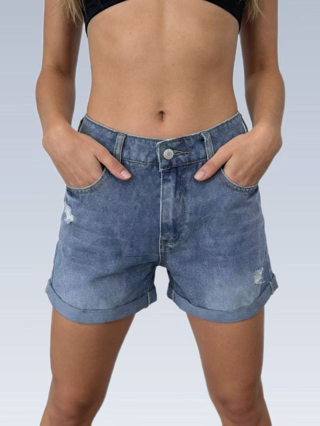 High-rise distressed denim shorts with cuffed hem