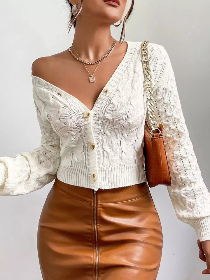 Cropped cable knit button-front cardigan with pointelle sleeves