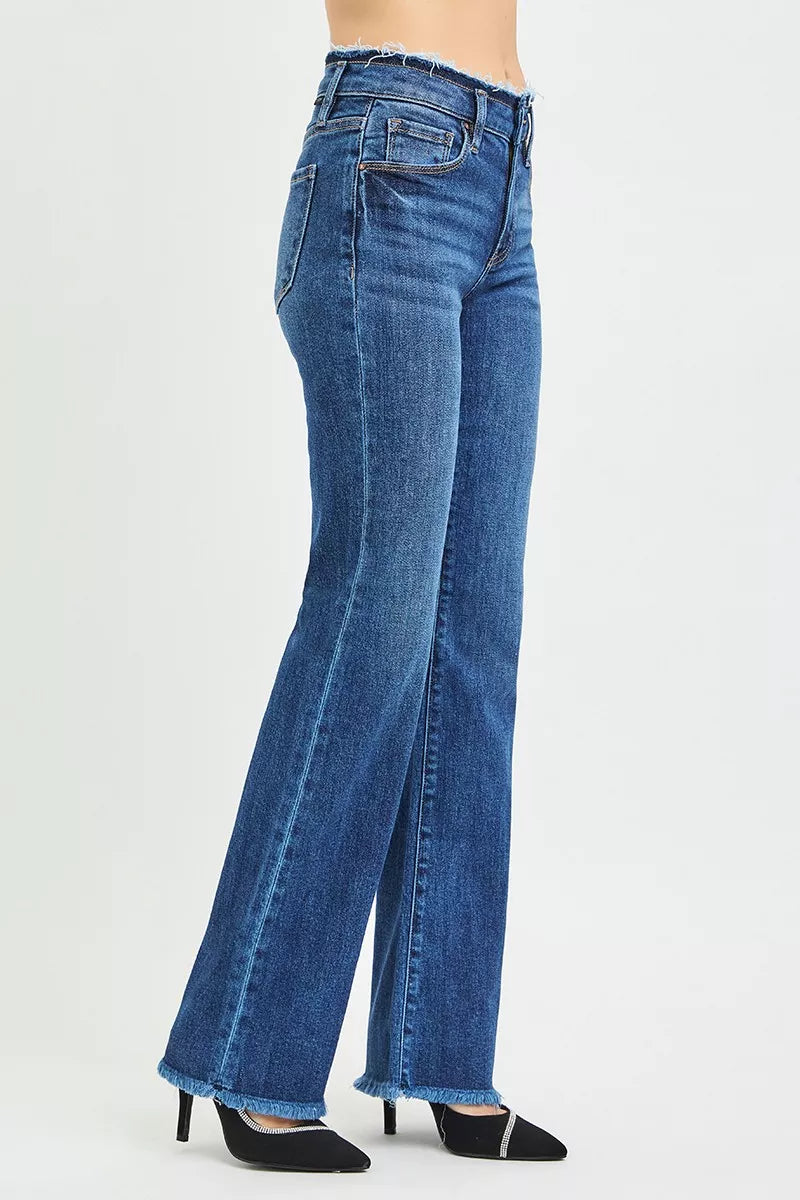 Mid-rise bootcut jeans with frayed waistband and raw hem