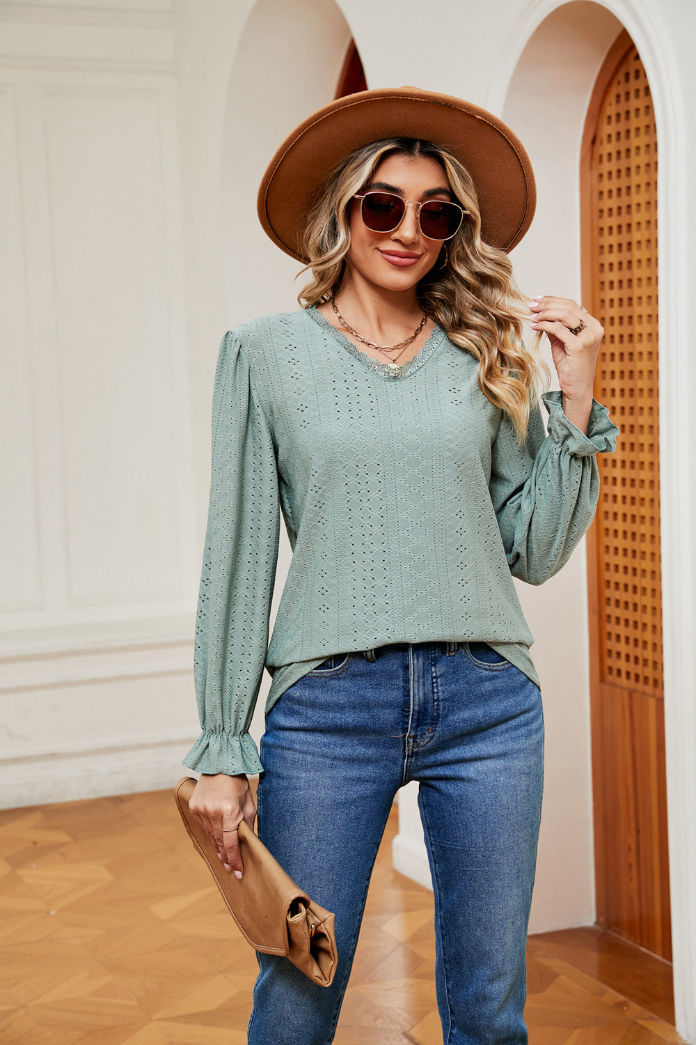 Eyelet V-neck blouse with flounce sleeves and lace trim