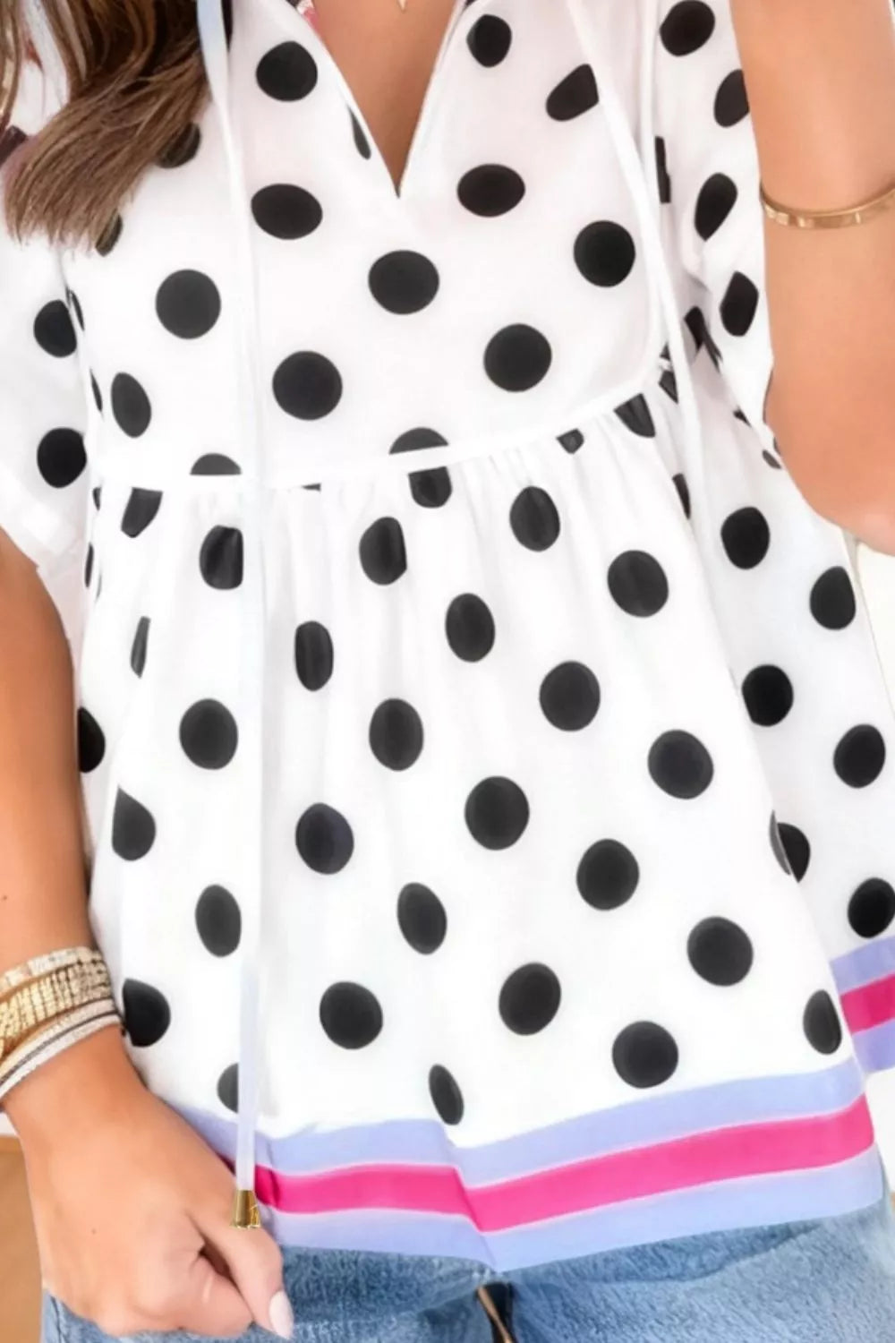 Polka dot tie-neck babydoll blouse with cap sleeves