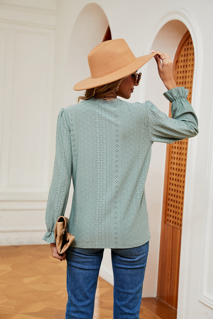 Eyelet V-neck blouse with flounce sleeves and lace trim