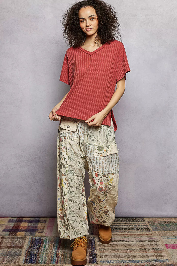 Ribbed knit V-neck tee with exposed seam and side slits