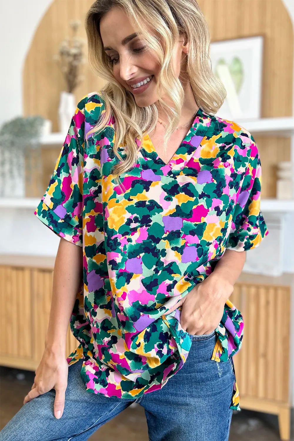 Abstract print v-neck tunic top with flutter sleeves and side slits