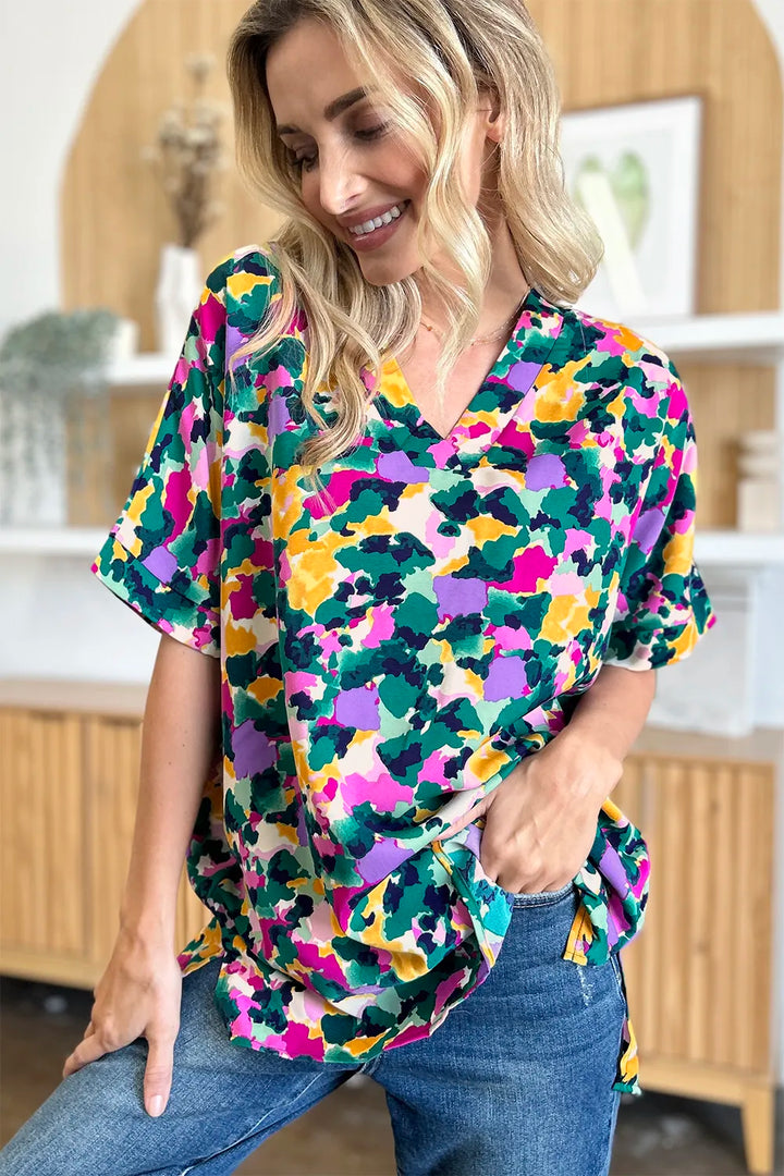 Abstract print v-neck tunic top with flutter sleeves and side slits